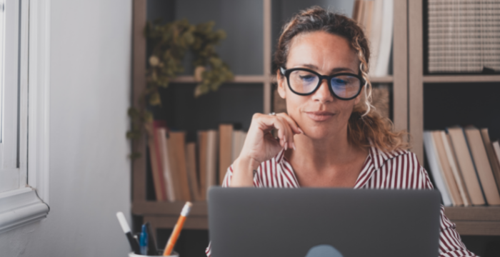 Woman at computer with headset